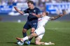 Bochum's Felix Passlack, left, and Kiel's Tymoteusz Puchacz, right, challenge for the ball during the German Bundesliga soccer match between VfL Bochum and Holstein Kiel in Bochum, Germany, Saturday, Sept. 21, 2024. (David Inderlied/dpa via AP)