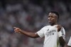 Real Madrid's Vinicius Junior, left, celebrates after he scored his team's third goal against Espanyol during a Spanish La Liga soccer match at Santiago Bernabeu stadium in Madrid, Spain, Saturday, Sept. 21, 2024. (AP Photo/Manu Fernandez)