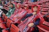 Fans wait in the rain before a baseball game between the Boston Red Sox and the Minnesota Twins, Saturday, Sept. 21, 2024, in Boston. The game was postponed to Sunday as part of a day/night doubleheader. (AP Photo/Michael Dwyer)