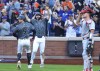 New York Mets' Pete Alonso, second from left, and Brandon Nimmo (9) react after scoring on a double by Francisco Alvarez during the seventh inning of a baseball game, Saturday, Sept. 21, 2024, in New York. (AP Photo/Noah K. Murray)