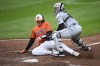 Detroit Tigers catcher Dillon Dingler, right, tags out Baltimore Orioles' Adley Rutschman, at home on a single by Heston Kjerstad during the fourth inning of a baseball game, Saturday, Sept. 21, 2024, in Baltimore. (AP Photo/Nick Wass)