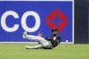 Chicago White Sox center fielder Luis Robert Jr. is unable to handle a double hit by San Diego Padres' Jurickson Profar during the fifth inning of a baseball game, Saturday, Sept. 21, 2024, in San Diego. (AP Photo/Ryan Sun)