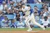 Los Angeles Dodgers designated hitter Shohei Ohtani (17) runs as he grounds out during the first inning of a baseball game against the Colorado Rockies in Los Angeles, Saturday, Sept. 21, 2024. (AP Photo/Ashley Landis)