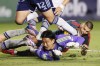 Los Angeles Galaxy's Dejan Joveljic, right, scores against Vancouver Whitecaps' Yohei Takaoka (1) during the second half of an MLS soccer match Saturday, Sept. 21, 2024, in Carson, Calif. (AP Photo/Etienne Laurent)