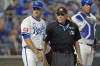 Kansas City Royals manager Matt Quatraro talks to home plate umpire Larry Vanover during the fourth inning of a baseball game against the Detroit Tigers Monday, Sept. 16, 2024, in Kansas City, Mo. (AP Photo/Charlie Riedel)