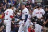 Boston Red Sox's Triston Casas celebrates his three-run home run with Vaughn Grissom (5) that also drove in Romy Gonzalez, right, during the first inning of the first game of a baseball doubleheader against the Minnesota Twins, Sunday, Sept. 22, 2024, in Boston. (AP Photo/Michael Dwyer)