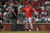 Cincinnati Reds manager David Bell, right, agues after being injected by home plate umpire Larry Vanover, left, during the sixth inning of a baseball game against the St. Louis Cardinals Tuesday, Sept. 10, 2024, in St. Louis. (AP Photo/Jeff Roberson)