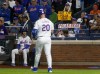 New York Mets' Pete Alonso walks back to the dugout after striking out in the first inning during a baseball game against the Philadelphia Phillies, Sunday, Sept. 22, 2024, in New York. (AP Photo/John Munson)