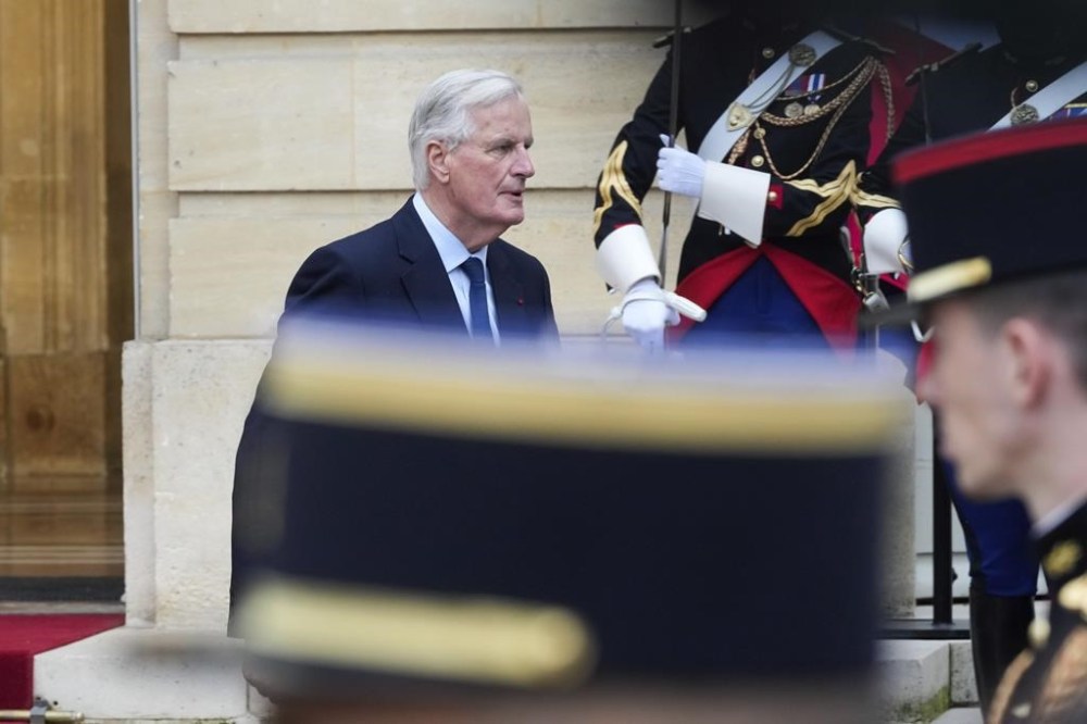 New French prime minister Michel Barnier leaves the handover ceremony, Thursday, Sept. 5, 2024 in Paris. (AP Photo/Michel Euler)