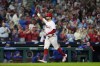Philadelphia Phillies' Kyle Schwarber reacts after hitting a home run against Chicago Cubs pitcher Caleb Kilian during the third inning of a baseball game, Monday, Sept. 23, 2024, in Philadelphia. (AP Photo/Matt Slocum)