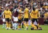Wolverhampton Wanderers' Yerson Mosquera lies on the pitch with an injury during the English Premier League soccer match between Aston Villa and Wolverhampton Wanderers at Villa Park, Birmingham, England, Saturday Sept. 21, 2024. (Martin Rickett/PA via AP)
