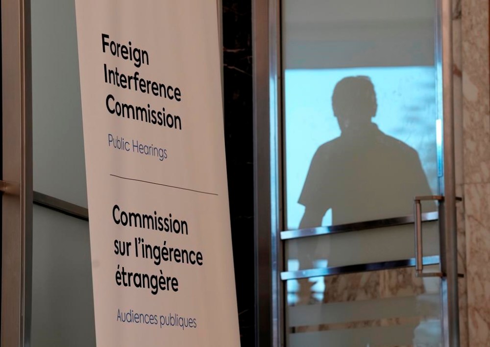 A man enters the hearing room as the Public Inquiry into Foreign Election Interference resumes in Ottawa, Monday, Sept. 16, 2024. THE CANADIAN PRESS/Adrian Wyld