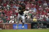 Pittsburgh Pirates' Michael A. Taylor doubles during the third inning of a baseball game against the St. Louis Cardinals Tuesday, Sept. 17, 2024, in St. Louis. (AP Photo/Jeff Roberson)