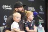 Colorado Rockies right fielder Charlie Blackmon talks to reporters during a news conference to discuss his retirement from the sport at season's end as his 2-year-old son, Wyatt, left, and 3-year-old daughter, Josie, look on Tuesday, Sept. 24, 2024, in Denver. (AP Photo/David Zalubowski)