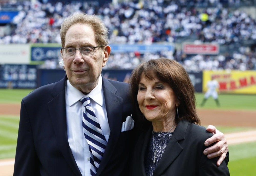 FILE 0 New York Yankees broadcasters John Sterling and Suzyn Waldman pose during a retirement ceremony for Sterling before a baseball game against the Tampa Bay Rays at Yankee Stadium in New York, Saturday, April 20, 2024. (AP Photo/Noah K. Murray, File)
