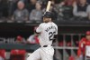 Chicago White Sox's Andrew Benintendi hits an RBI single during the eighth inning of a baseball game against the Los Angeles Angels, Tuesday, Sept. 24, 2024, in Chicago. (AP Photo/Melissa Tamez)