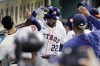Houston Astros' Jason Heyward (22) collects high-fives in the dugout after his two-run home run against the Seattle Mariners during the fifth inning of a baseball game Tuesday, Sept. 24, 2024, in Houston. (AP Photo/Michael Wyke)