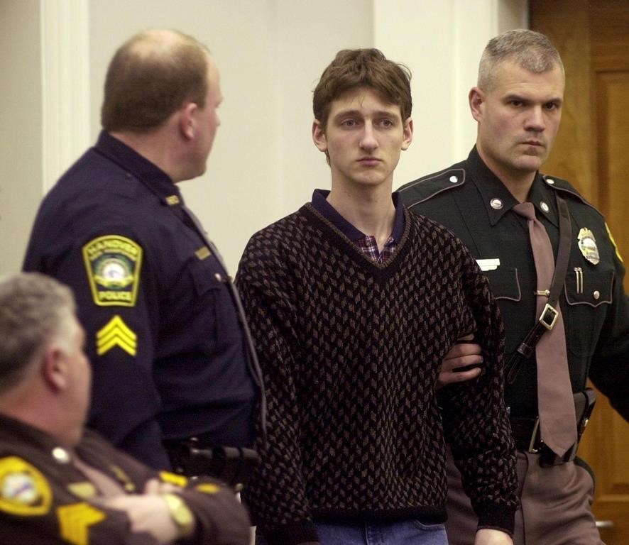 FILE - Robert Tulloch, 17, is escorted into Lebanon, N.H. District Court by Tropper James Stienmetz, right, and Hanover Sgt. Jeffrey Fleury, Feb. 21, 2001. (AP Photo/Jim Cole, File)