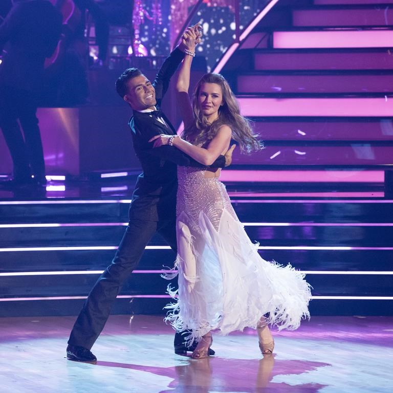 This image released by Disney shows Anna Delvey, right, and her dancing partner Ezra Sosa on the celebrity dance competition series