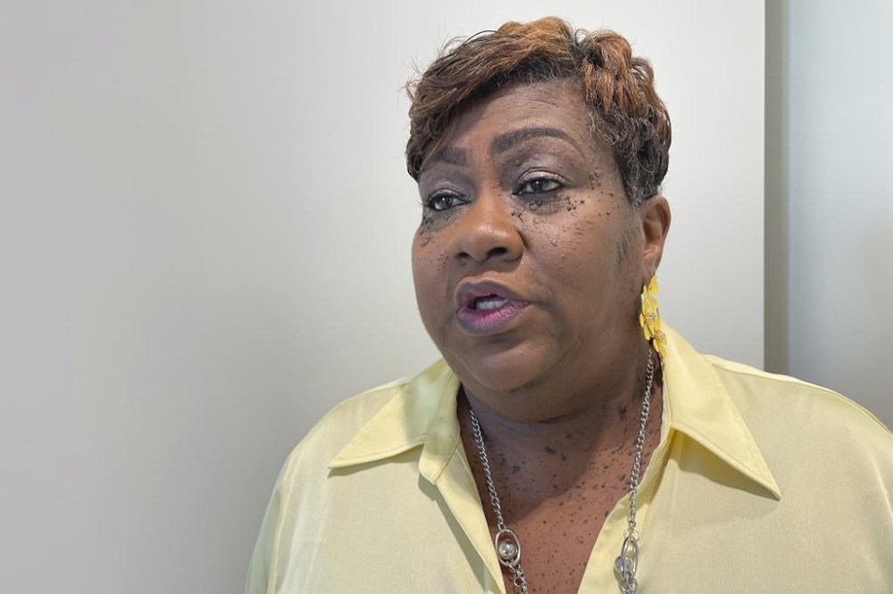 Angela English, president of the NAACP chapter in Rankin County, Miss., speaks in the hallway of the federal courthouse in Jackson, Miss., Wednesday, Sept. 25, 2024. (AP Photo/Emily Wagster Pettus)