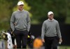 International team members Mackenzie Hughes and Corey Conners of Canada, walk up to the 12th hole during practice at the Presidents Cup golf tournament at the Royal Montreal Golf Club, Wednesday, Sept. 25, 2024 in Montreal. THE CANADIAN PRESS/Christinne Muschi