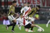 Alan Saldivia, left, and Esteban Pavez of Chile's Colo Colo, right, battle for the ball with Facundo Colidio of Argentina's River Plate Coloduring a Copa Libertadores quarterfinal second leg soccer match at Monumental stadium in Buenos Aires, Argentina, Tuesday, Sept. 24, 2024. (AP Photo/Gustavo Garello)