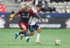 Toronto FC's Federico Bernardeschi, left, and Vancouver Whitecaps' Andres Cubas vie for the ball during the first half of the Canadian Championship final soccer match, in Vancouver, on Wednesday, September 25, 2024. THE CANADIAN PRESS/Darryl Dyck
