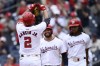 Washington Nationals' Luis Garcia Jr. (2) celebrates his three-run home run with Juan Yepez, center, and James Wood, right, during the third inning of a baseball game against the Kansas City Royals, Thursday, Sept. 26, 2024, in Washington. (AP Photo/Nick Wass)