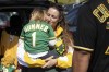 Marta Sutter holds her daughter, 3-year-old Summer Sutter outside the Oakland Coliseum before a baseball game between the Oakland Athletics and the Texas Rangers Thursday, Sept. 26, 2024, in Oakland, Calif. (AP Photo/Benjamin Fanjoy)