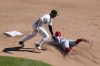 Chicago White Sox second baseman Lenyn Sosa catches Los Angeles Angels' Zach Neto trying to steal second during the fourth inning of a baseball game Thursday, Sept. 26, 2024, in Chicago. (AP Photo/Charles Rex Arbogast)