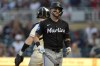 Miami Marlins' Connor Norby walks back to the dugout after striking out during the first inning of a baseball game against the Minnesota Twins, Thursday, Sept. 26, 2024, in Minneapolis. (AP Photo/Abbie Parr)