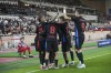 Barcelona's players celebrate after their teammate Lamine Yamal scored his side's opening goal during the Champions League opening phase soccer match between Monaco and Barcelona at the Louis II stadium, in Monaco, Monaco, Thursday, Sept. 19, 2024. (AP Photo/Laurent Cipriani)