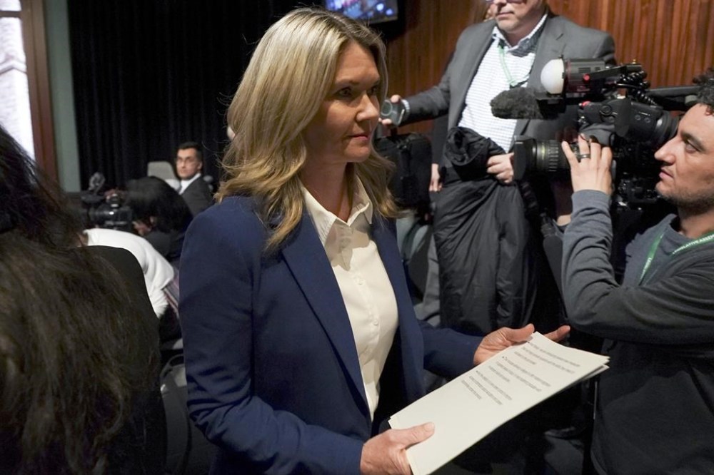 Jill Dunlop leaves a press conference at Queen's Park in Toronto on Feb 26. Ontario's education minister is telling school boards to keep classrooms free of