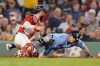 Tampa Bay Rays' Jonny DeLuca is out at home plate against Boston Red Sox catcher Connor Wong while trying to score on a double by Josh Lowe during the seventh inning of a baseball game, Friday, Sept. 27, 2024, in Boston. (AP Photo/Michael Dwyer)