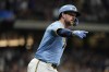 Milwaukee Brewers' Rhys Hoskins gestures after hitting a grand slam during the first inning of a baseball game against the New York Mets, Friday, Sept. 27, 2024, in Milwaukee. (AP Photo/Aaron Gash)