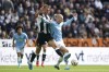 Newcastle United's Dan Burn, left, and Manchester City's Erling Haaland battle for the ball during the Premier League match between Newcastle and Manchester City, at St James' Park, Newcastle upon Tyne, England, Saturday Sept. 28, 2024. (Owen Humphreys/PA via AP)