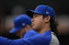 Chicago Cubs pitcher Shota Imanaga stands in the dugout during the first inning of a baseball game against the Cincinnati Reds, Friday, Sept. 27, 2024, in Chicago. (AP Photo/Erin Hooley)