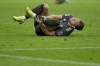 Munich's Harry Kane lies on the pitch in pain during the German Bundesliga soccer match between Bayern Munich and Leverkusen at the Allianz Arena in Munich, Germany, Saturday, Sept. 28, 2024. (Sven Hoppe/dpa via AP)