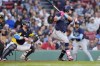 Tampa Bay Rays' Jonathan Aranda, right, follows through on an RBI single in front of Boston Red Sox catcher Danny Jansen, left, during the fifth inning of a baseball game, Saturday, Sept. 28, 2024, in Boston. (AP Photo/Michael Dwyer)