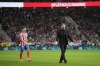 Atletico Madrid's head coach Diego Simeone reacts as the play was suspended after fans threw objects on the pitch during the La Liga soccer match between Atletico Madrid and Real Madrid at the Metropolitano stadium in Madrid, Spain, Sunday, Sept. 29, 2024. (AP Photo/Bernat Armangue)