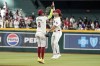 Arizona Diamondbacks' Geraldo Perdomo (2) and Alek Thomas, right, celebrate their win over the San Diego Padres at the end of the ninth inning of a baseball game, Sunday, Sept. 29, 2024, in Phoenix. (AP Photo/Darryl Webb)