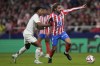 Real Madrid's Rodrygo holds Atletico Madrid's Antoine Griezmann during the La Liga soccer match between Atletico Madrid and Real Madrid at the Metropolitano stadium in Madrid, Spain, Sunday, Sept. 29, 2024. (AP Photo/Bernat Armangue)
