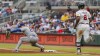 New York Mets first baseman Pete Alonso, left, catches the ball before Atlanta Braves' Jorge Soler, right, can reach first in the fourth inning of the second baseball game of a doubleheader, Sept. 30, 2024, in Atlanta. (AP Photo/Jason Allen)
