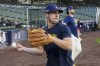 Milwaukee Brewers Sal Frelick throws before Game 1 of a National League wild card baseball game against the New York Mets Tuesday, Oct. 1, 2024, in Milwaukee. (AP Photo/Morry Gash)
