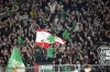 Celtic fans wave the flag of Lebanon ahead of the Champions League opening phase soccer match between Borussia Dortmund and Celtic FC at the BVB Stadion in Dortmund, Tuesday, Oct. 1, 2024. (AP Photo/Martin Meissner)