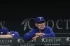 Texas Rangers manager Bruce Bochy looks on from the dugout during the second inning of a baseball game against the Seattle Mariners, Saturday, Sept. 21, 2024, in Arlington, Texas. (AP Photo/LM Otero)