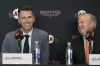 San Francisco Giants president of baseball operations Buster Posey, left, smiles next to chairman Greg Johnson during a news conference in San Francisco, Tuesday, Oct. 1, 2024. (AP Photo/Jeff Chiu)
