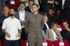 Wojciech Szczesny, centre, a new goalkeeper for Barcelona is on stands during the Champions League soccer match between Barcelona and Young Boys at the Lluis Companys Olympic Stadium in Barcelona, Spain, Tuesday, Oct. 1, 2024. (AP Photo/Joan Monfort)