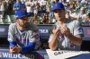 New York Mets' Max Kranick talks to New York Mets' Danny Young before Game 1 of a National League wild card baseball game against the Milwaukee Brewers Tuesday, Oct. 1, 2024, in Milwaukee. (AP Photo/Morry Gash)