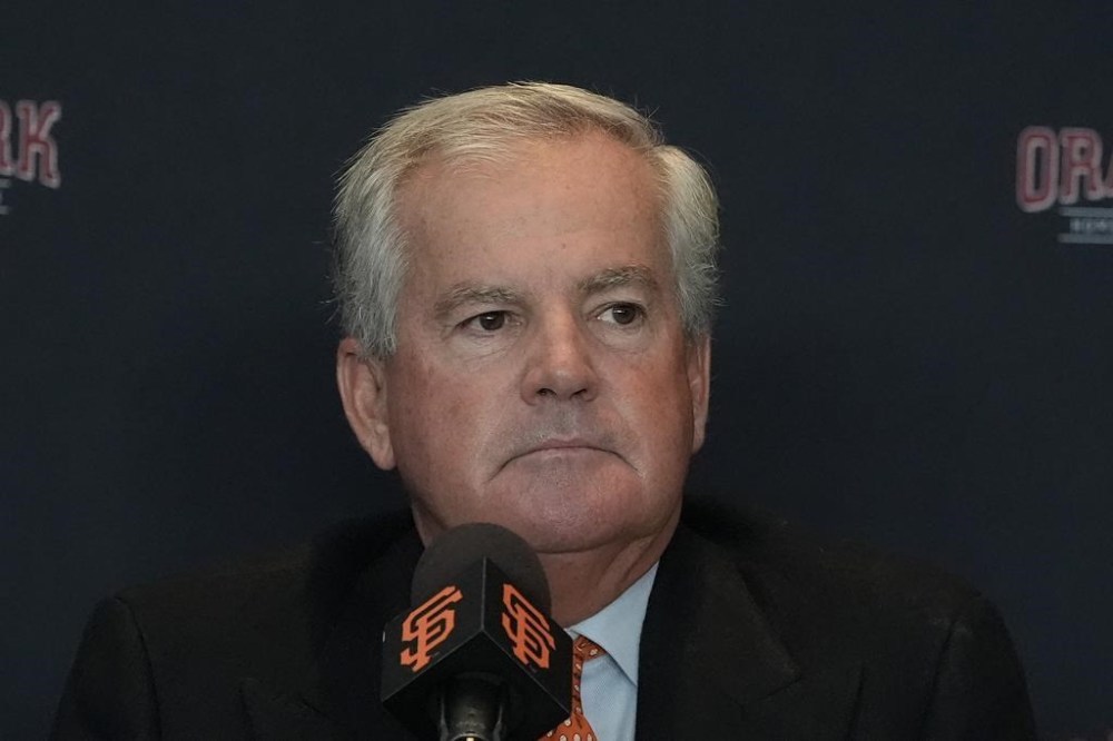 San Francisco Giants baseball team chairman Greg Johnson listens to speakers during news conference in San Francisco, Tuesday, Oct. 1, 2024. (AP Photo/Jeff Chiu)